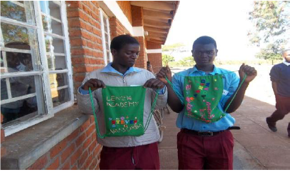 two boys holding school bags