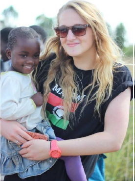 blonde girl holding young girl